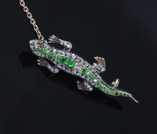 A late Victorian gold and silver, demantoid garnet and rose cut diamond set lizard brooch, 40mm.